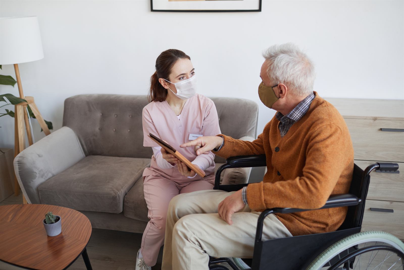 A Labs On Call phlebotomist with a patient in a long-term care setting